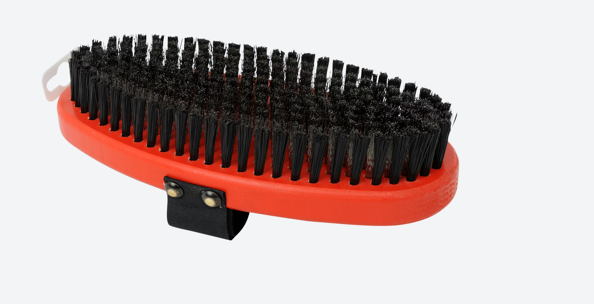 Swix brush for ski waxing, featuring a sturdy handle and bristles for effective application and grooming of ski bases.